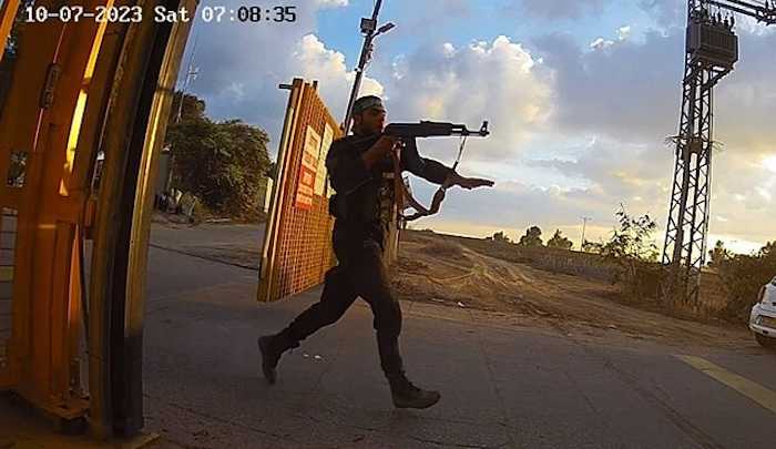 Hamas soldier storming Alumim in southern Israel during Operation Al-Aqsa Flood on 7 October 2023, CCTV footage: No human authorship, Public domain