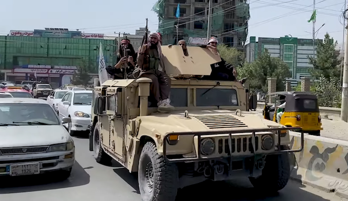 Taliban fighters in a captured Humvee, Voice of America News, Public domain